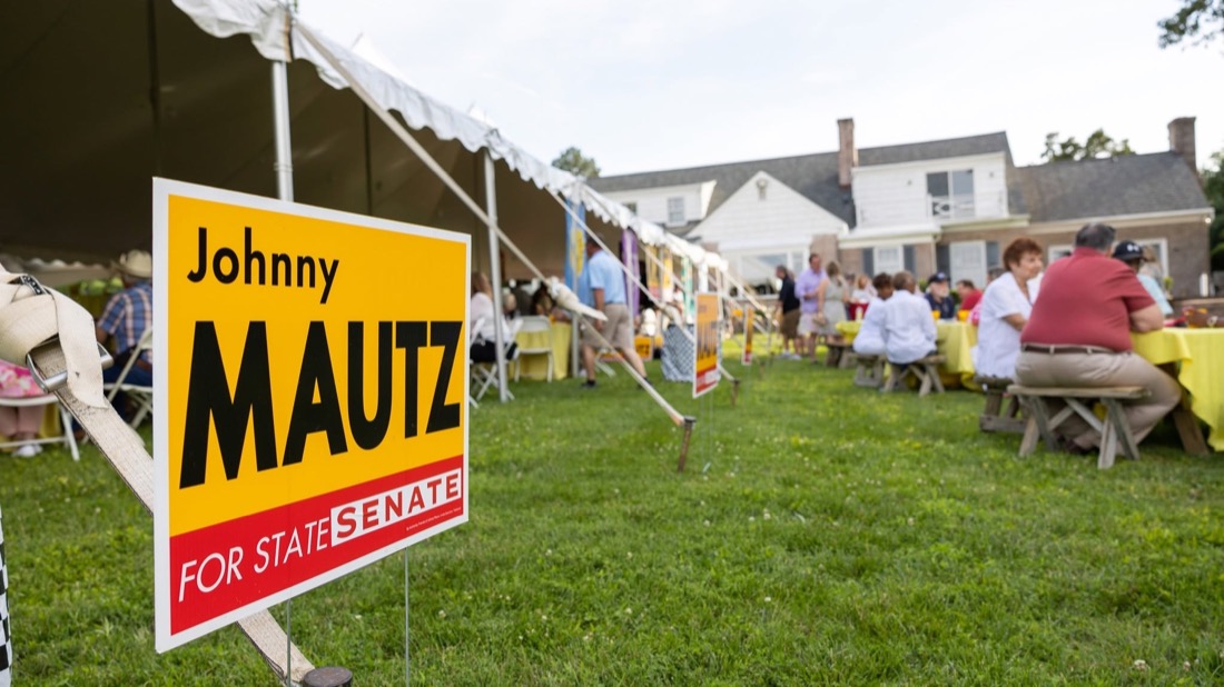 Johnny Mautz for State Senate yard sign at a campaign event