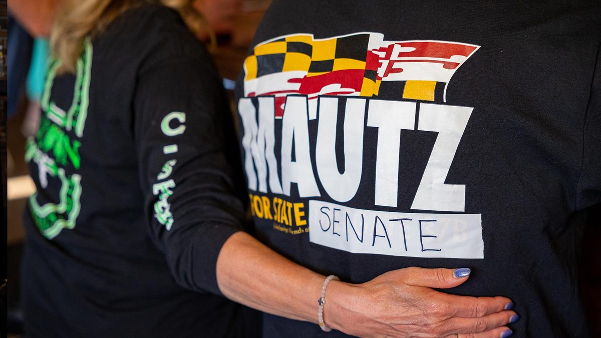A supporter in a Mautz for State Senate shirt with the Maryland flag
