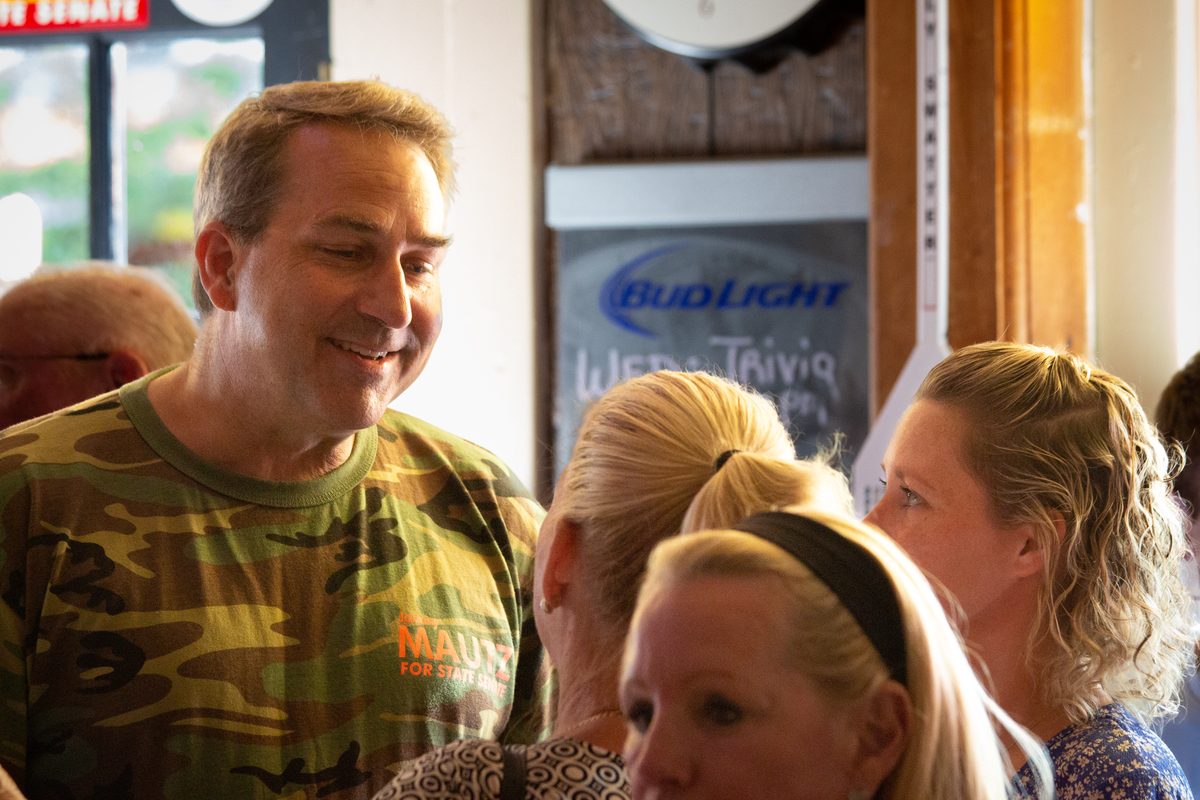 State Senator Johnny Mautz talking with constituents at Carpenter Street Saloon